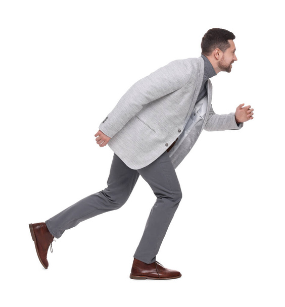 Handsome bearded businessman running on white background - Foto, Imagem