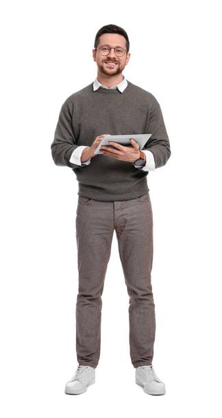 Handsome bearded businessman in eyeglasses with tablet on white background - Fotó, kép