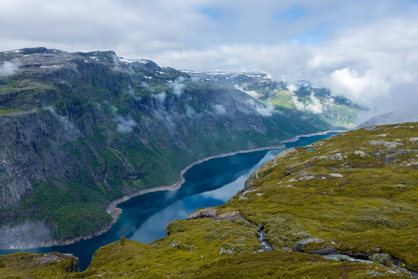 Beautiful view of the lake in Trolltunga hiking trail, Norway - Photo, image
