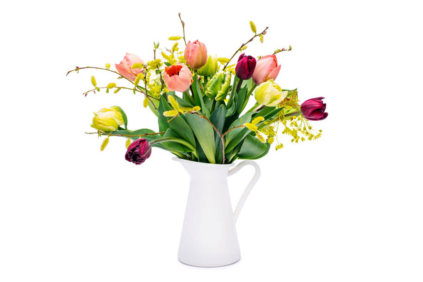 Elegant mixed tulips spring bouquet in white vase on white background. Spring tulips. Tulips bouquet cut out. - Foto, imagen