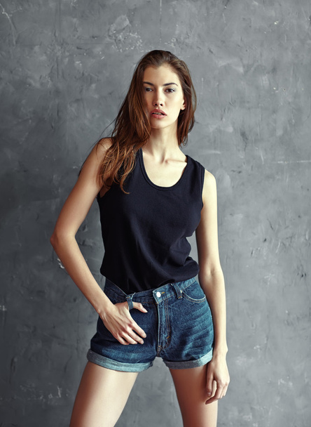 Young woman in jeans shorts - Foto, imagen