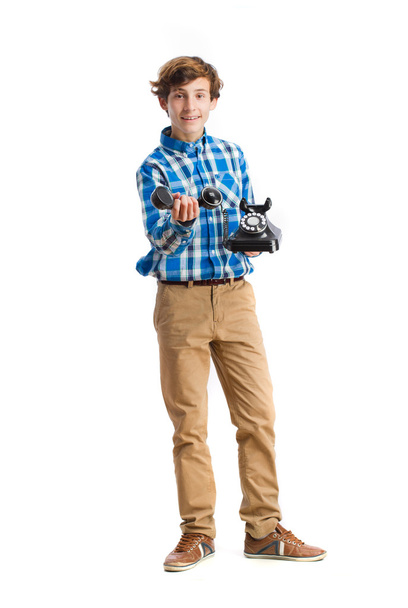 teenager showing a telephone - Valokuva, kuva