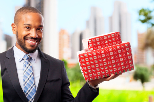 young cool black man with boxes - Foto, Imagem
