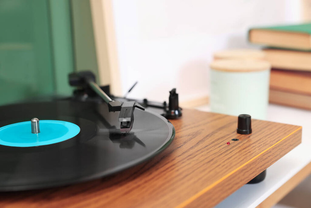 Stylish turntable with vinyl record indoors, closeup. Space for text - Photo, Image