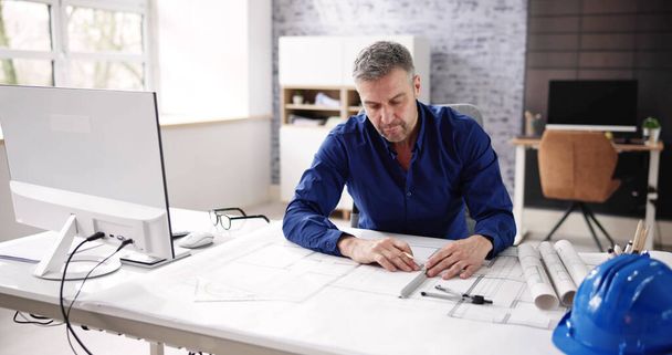 Architect Engineer Drawing Architectural Construction Plan In Office - 写真・画像