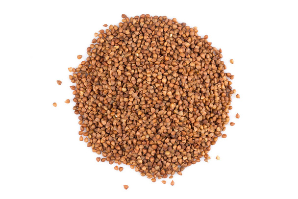 Pile of buckwheat seeds isolated over the white background - Foto, Imagen