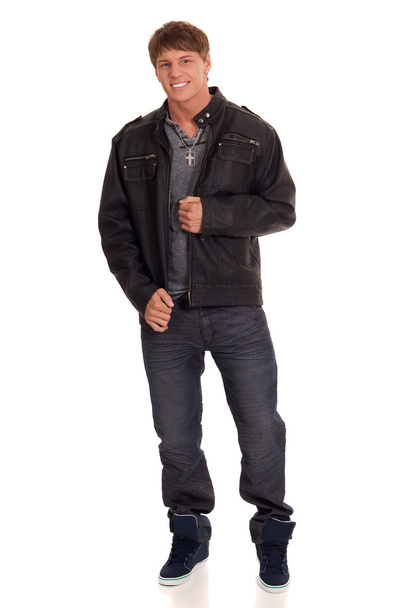 Man in jeans and leather jacket. Studio shot over white. - Foto, Imagem