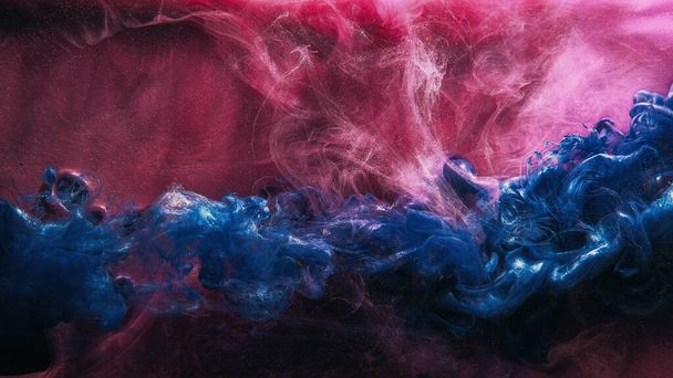 Glitter fluid. Ink water shot. Paint blend. Pink blue color shiny glowing sparkling smoke cloud abstract art background with free space. - Valokuva, kuva