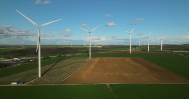 Renewable energy source. Aerial view of wind turbines standing on the green field. Aerial view of a farm with wind turbines. Generating clean renewable energy. Alternative energy. - Footage, Video