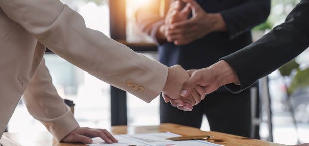 Business people shaking hands, finishing up meeting, business etiquette, congratulation, merger and acquisition concept... - Photo, Image