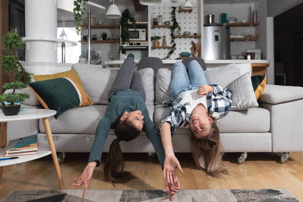 LGBT Lesbian woman couple love moments happiness concept at home having fun and nice time alone and together in their new apartment, living together - Фото, изображение