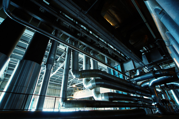 Промислова зона, сталеві трубопроводи в синіх тонах
 - Фото, зображення