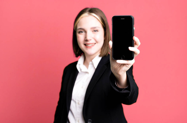young pretty businesswoman using her smartphone - Photo, image
