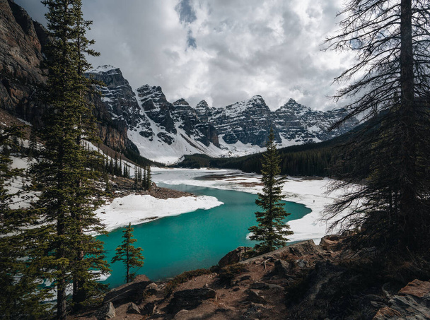 First snow Morning at Moraine Lake in Banff National Park Alberta Canada Snow-covered winter mountain lake in a winter atmosphere. Beautiful background photo. - Fotó, kép