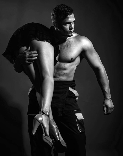 Sexy young couple body at night. Temptation sexy couple. Muscular man hold naked woman - Valokuva, kuva