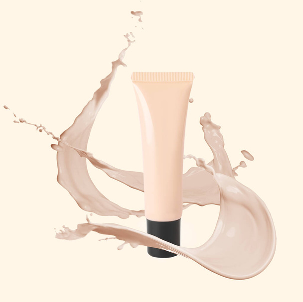 Liquid foundation in tube and splashes of makeup product on beige background - Photo, Image