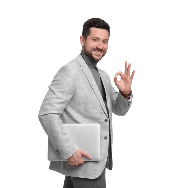 Handsome bearded businessman with tablet showing OK gesture on white background - Zdjęcie, obraz