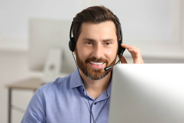 Hotline operator with headset working in office, space for text - Foto, Imagem