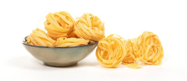 Tagliatelle pasta rolls on a white background - Photo, Image