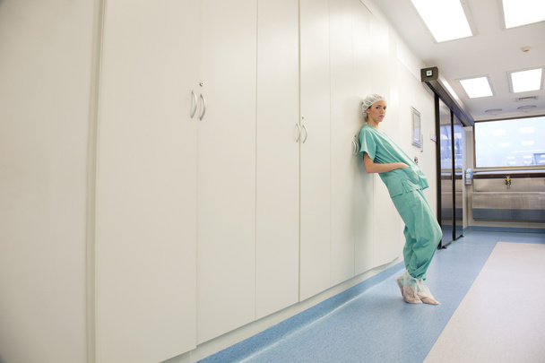 Young woman doctor in corridor - Фото, изображение