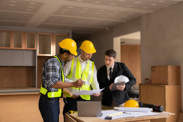 Meeting engineers or architects for projects, working with partners and engineering tools to create workplace models and blueprints. construction concept - Photo, Image