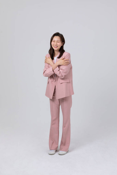 business concept korean young woman, pleased. studio shot - Photo, Image