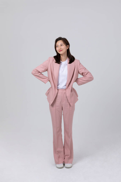 business concept korean young woman, pleased. studio shot - Foto, imagen