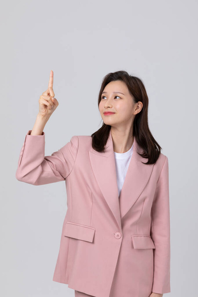 business concept korean young woman, gesture. studio shot - Zdjęcie, obraz