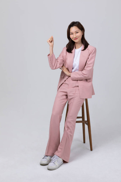 business concept korean young woman, sitting. studio shot - Photo, Image