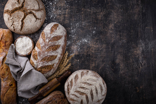 Fresh homemade bread with a crispy crust. Bakery concept - Фото, изображение