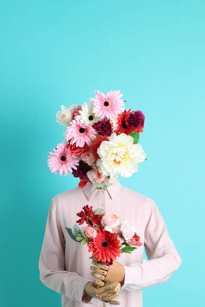 The concept picture of female mannequin decorated with flower. - Foto, Imagem