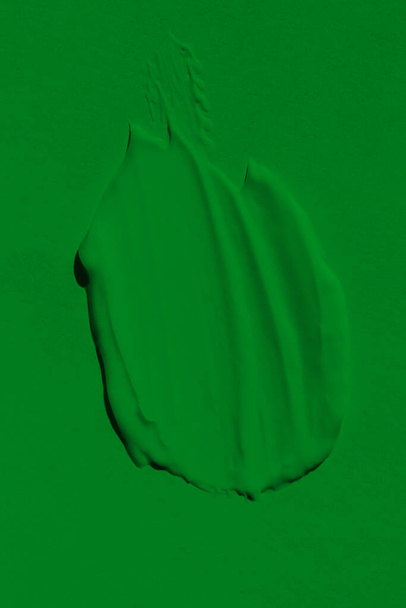 The leaky texture of the green paint. Smudged paint is a liquid green color. Background green color lunge, spreading in the light. Applied to the surface. grassy, natural - Foto, immagini
