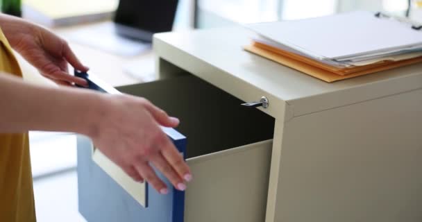 Woman manager secretary closes drawer with key with documents. Document security in business - Footage, Video