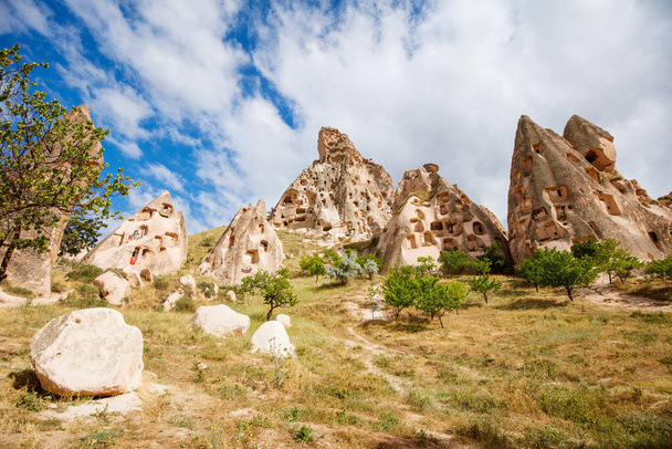 View of Uchisar castle rock formations and fairy chimneys in Cappadocia Turkey - 写真・画像