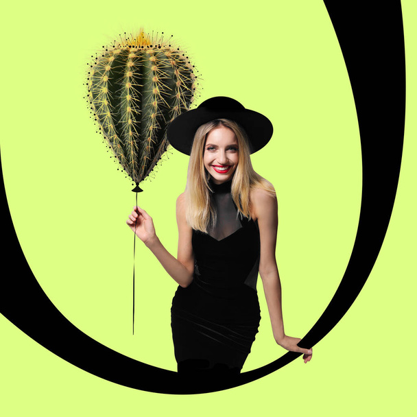Stylish artwork. Woman in hat holding cactus as balloon on yellow green background - Fotoğraf, Görsel
