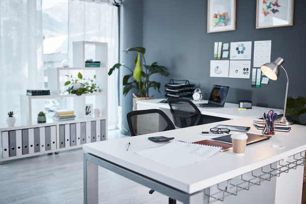 Empty office, interior and workspace with furniture, table and professional layout in startup agency. Background of modern workplace, business building and room in company, job venue or minimal setup. - Photo, Image