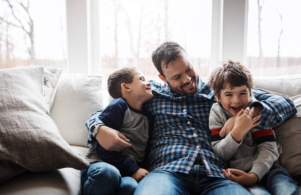 Happy families make time for quality time. Portrait of two adorable little boys having fun with their father at home - Fotoğraf, Görsel