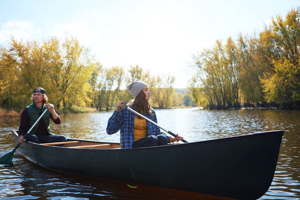 The perfect date for an outdoorsy couple. a young couple going for a canoe ride on the lake - Photo, Image
