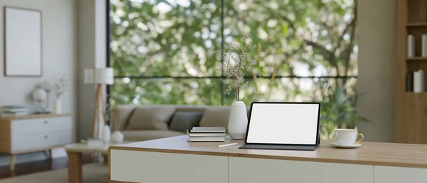 Home workspace in minimal beautiful living room with portable tablet white screen mockup, wireless keyboard and decor. 3d render, 3d illustration - Photo, Image