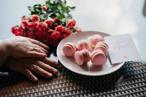 Pink macaroons in a cafe. Gender party is a girl - Фото, изображение