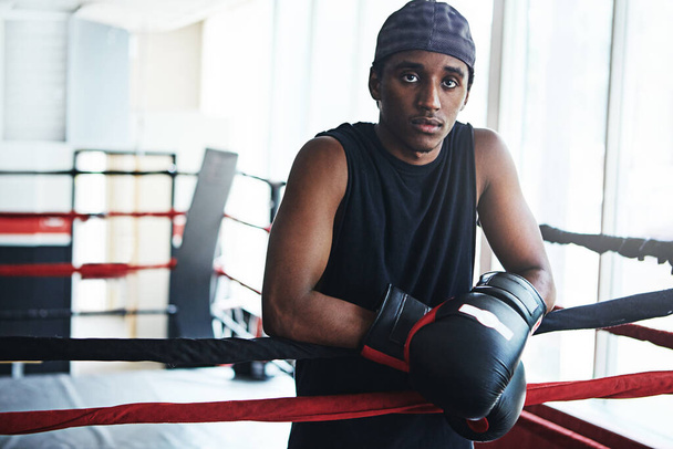 Here to be the best and beat the best. Portrait of a young man training in a boxing ring - Photo, Image