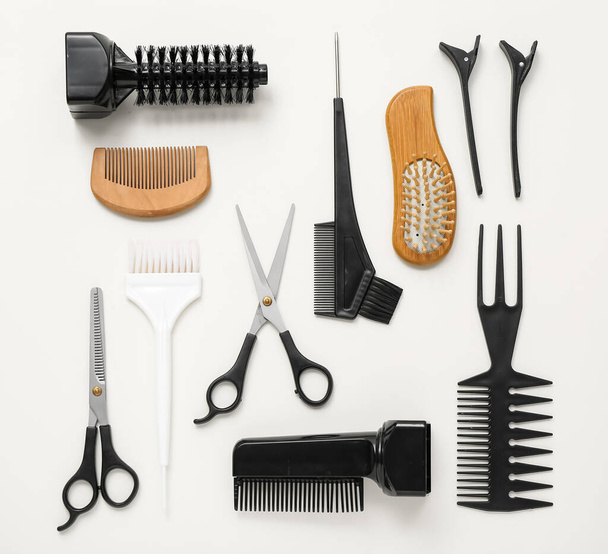 Composition with hairdressing accessories on light background - Fotografie, Obrázek