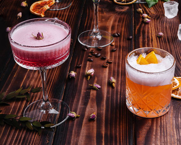 different colorful exotic alcoholic cocktails on wood - Fotó, kép