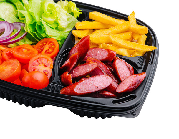 Grilled sausages, French fries and vegetables - Photo, Image
