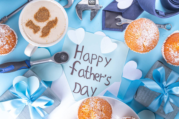 Father's day holiday greeting card. Father's Day morning breakfast with cute surprise background, with gift boxes, cupcakes, coffee mug, heart decor, tools and ties, Happy Father's Day letter - Foto, Imagem