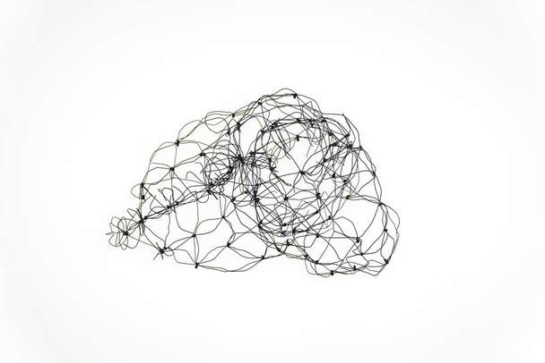 An abstract artsy wire sculpture isolated on an empty white background - Фото, зображення