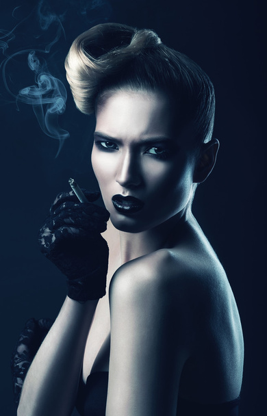 Woman with cigarette and smoke - Photo, Image