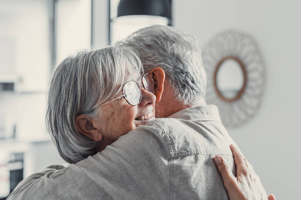 Happy mature couple in love embracing, laughing grey haired husband and wife with closed eyes, horizontal banner, middle aged smiling family enjoying tender moment, happy marriage, sincere feelings - Fotoğraf, Görsel
