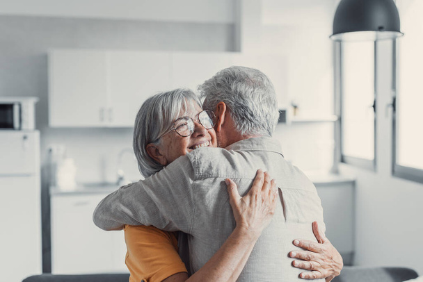 Happy mature couple in love embracing, laughing grey haired husband and wife with closed eyes, horizontal banner, middle aged smiling family enjoying tender moment, happy marriage, sincere feelings - Foto, afbeelding