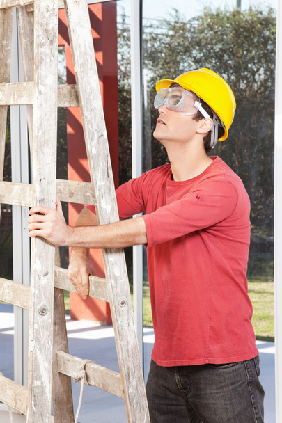 Architect holding ladder - Фото, зображення